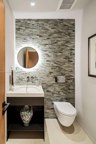 a view of a backyard with chairs under an umbrella