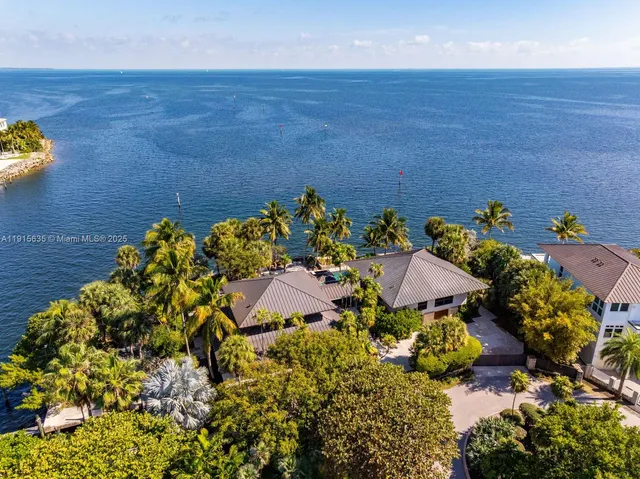 a view of a patio with table and chairs potted plants