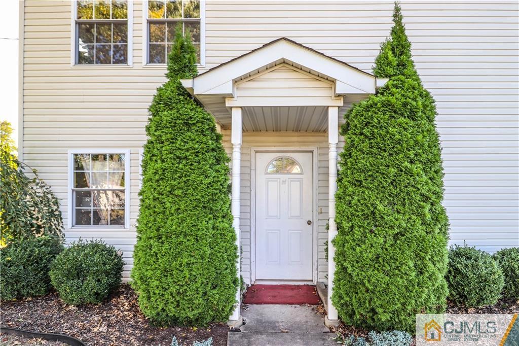 2 Altamont Road Edison, NJ 08817 - Photo 2 of 40 a front view of a house with a yard garage and outdoor seating