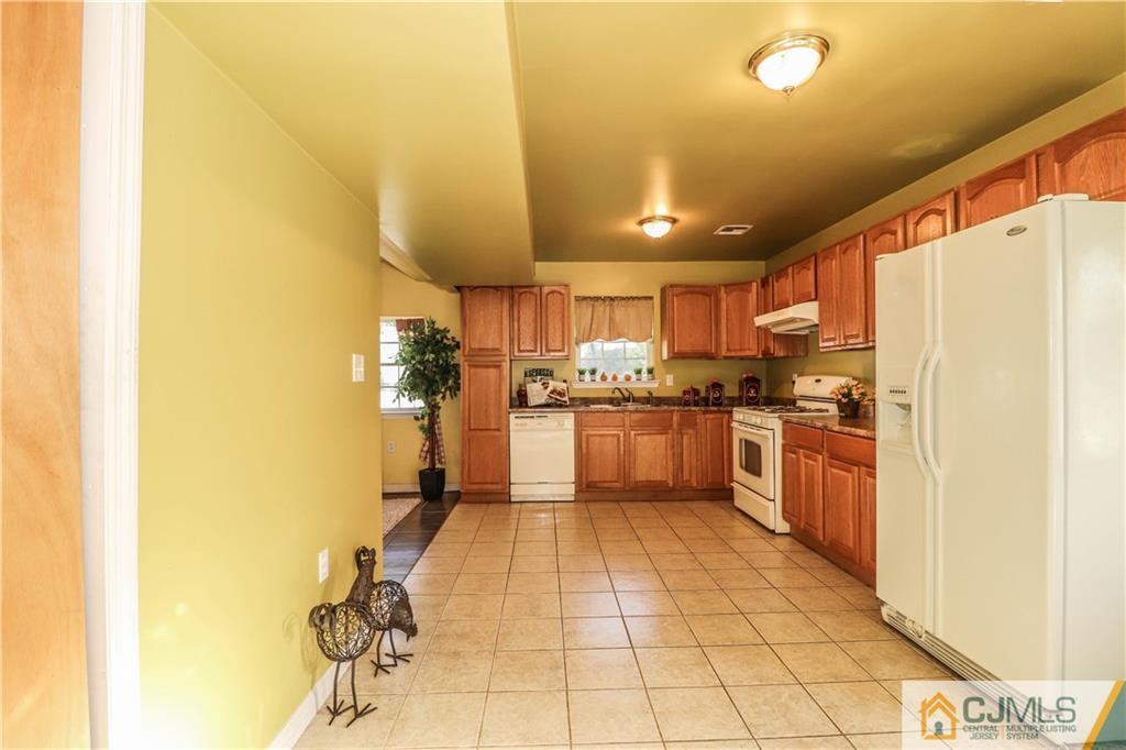 2 Altamont Road Edison, NJ 08817 - Photo 13 of 40 a kitchen with stainless steel appliances a refrigerator and a stove top oven