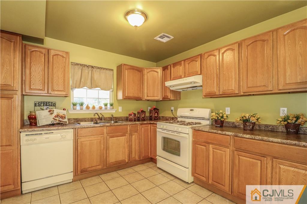2 Altamont Road Edison, NJ 08817 - Photo 14 of 40 a kitchen with cabinets appliances and a sink
