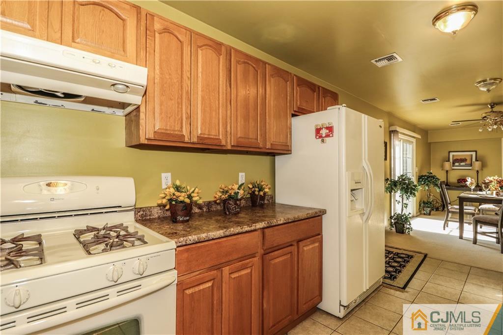 2 Altamont Road Edison, NJ 08817 - Photo 16 of 40 a kitchen with a refrigerator and a stove