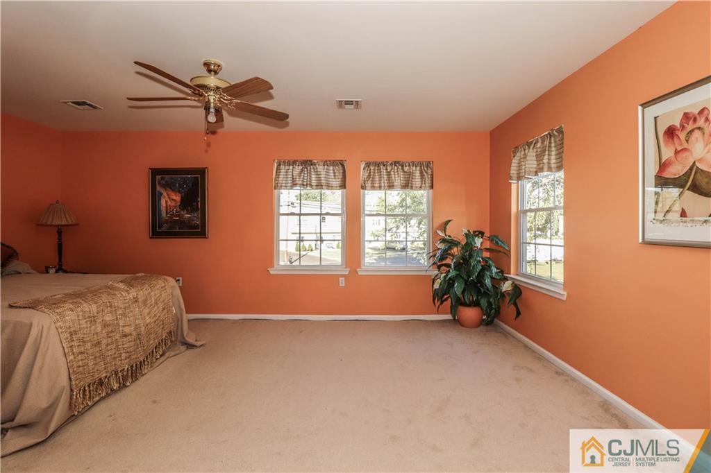 2 Altamont Road Edison, NJ 08817 - Photo 20 of 40 a spacious bedroom with a bed and a window