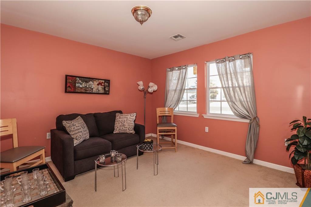 2 Altamont Road Edison, NJ 08817 - Photo 3 of 40 a couch sitting in a room next to a window