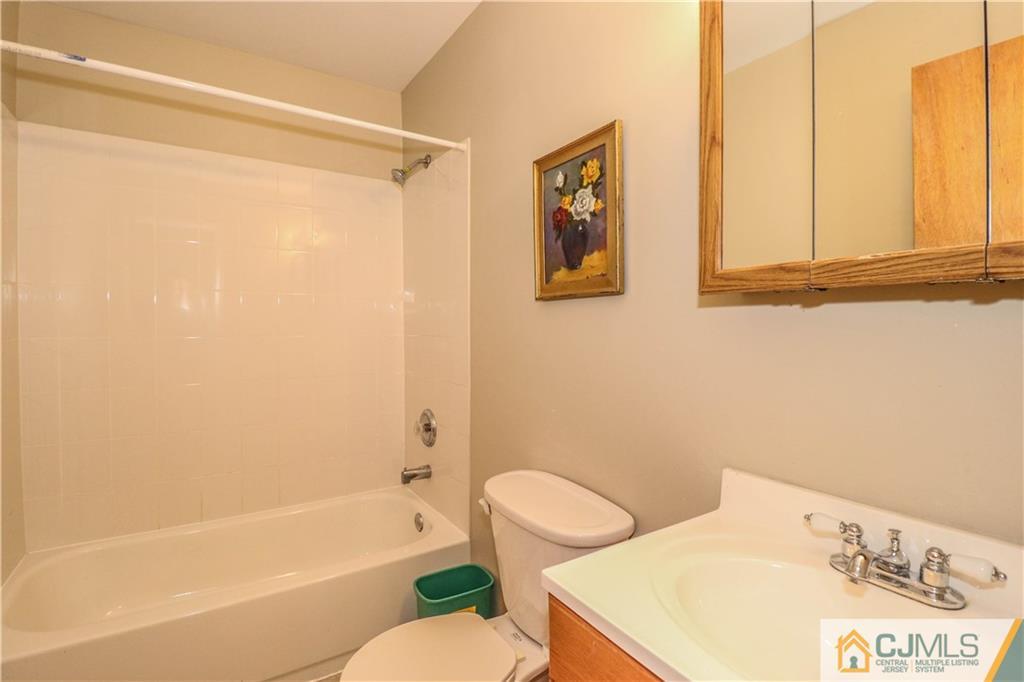 2 Altamont Road Edison, NJ 08817 - Photo 26 of 40 a bathroom with a sink and a bathtub