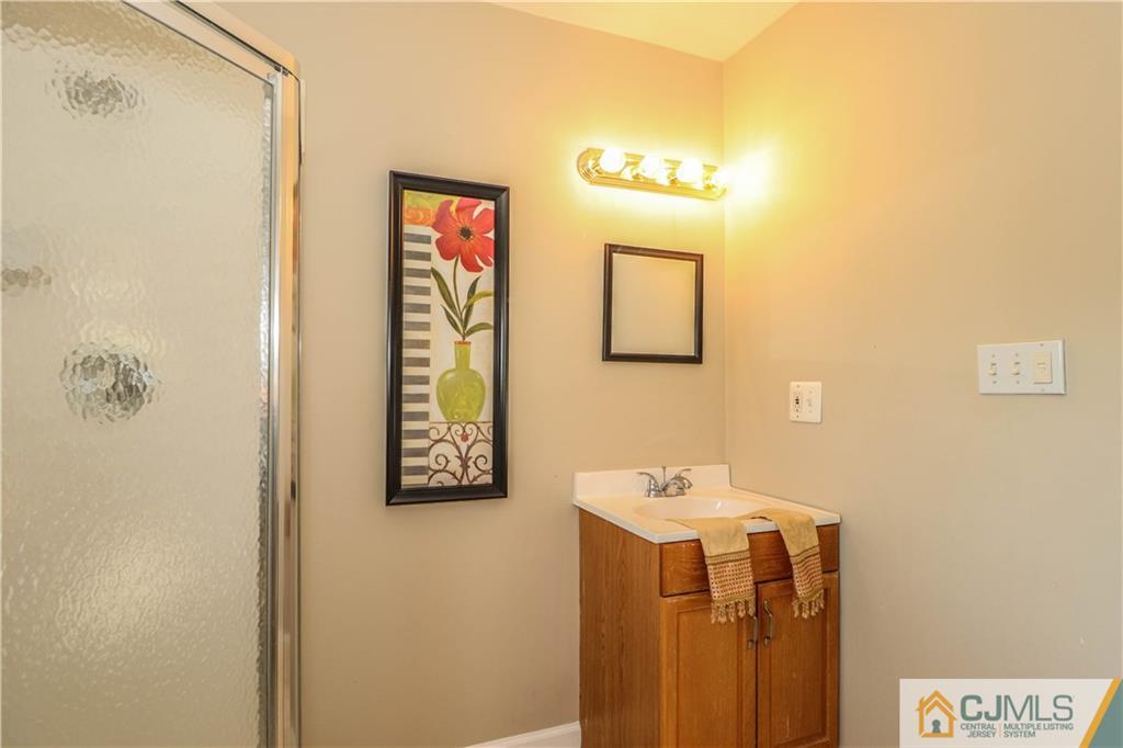 2 Altamont Road Edison, NJ 08817 - Photo 28 of 40 a bathroom with a sink and a mirror