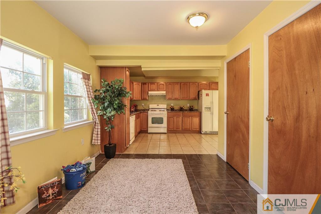 2 Altamont Road Edison, NJ 08817 - Photo 4 of 40 a view of a hallway with wooden floor and a living room