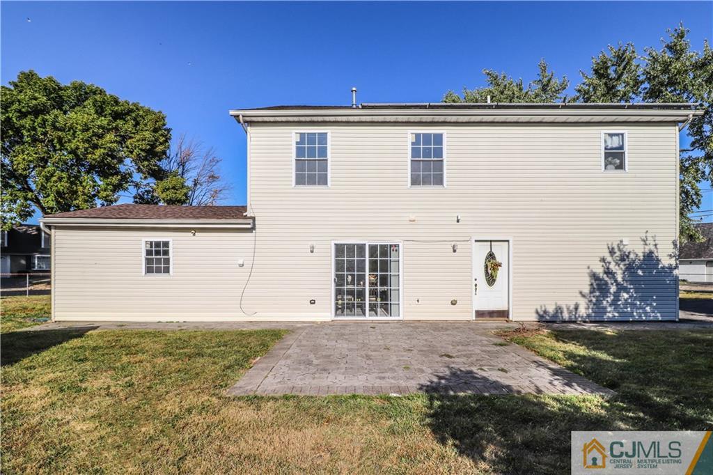 2 Altamont Road Edison, NJ 08817 - Photo 35 of 40 a front view of a house with a yard and garage