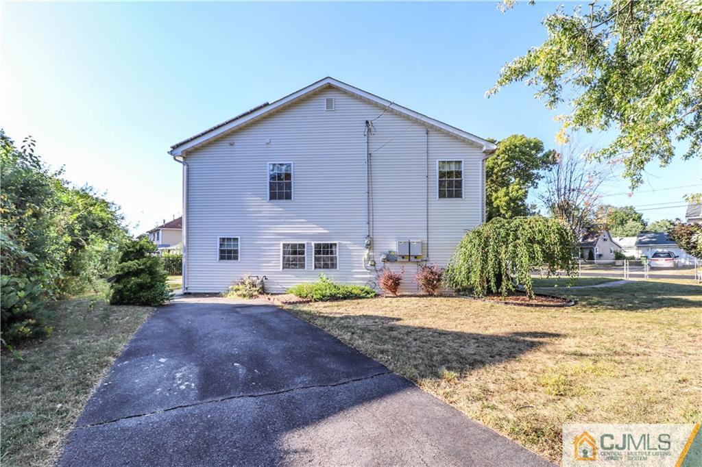 2 Altamont Road Edison, NJ 08817 - Photo 37 of 40 a front view of a house with garden