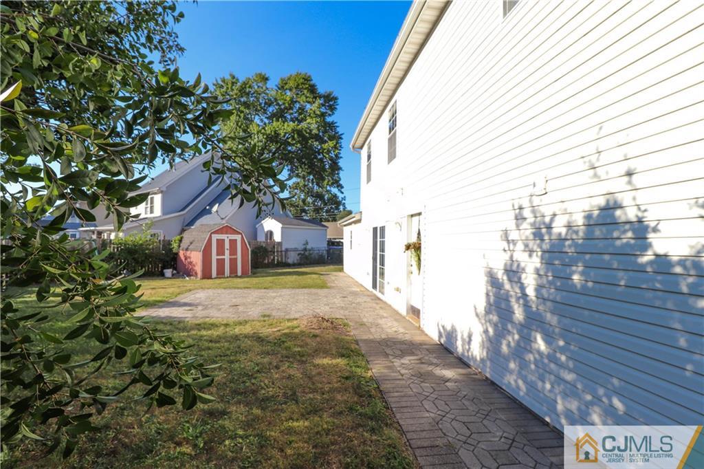 2 Altamont Road Edison, NJ 08817 - Photo 38 of 40 a view of a house with a yard and garage