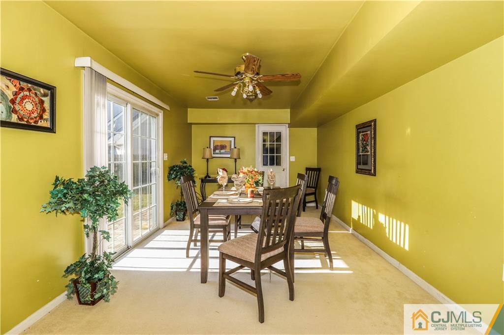 2 Altamont Road Edison, NJ 08817 - Photo 6 of 40 a view of a dining room with furniture and a potted plant