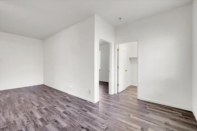 a view of front door with wooden floor