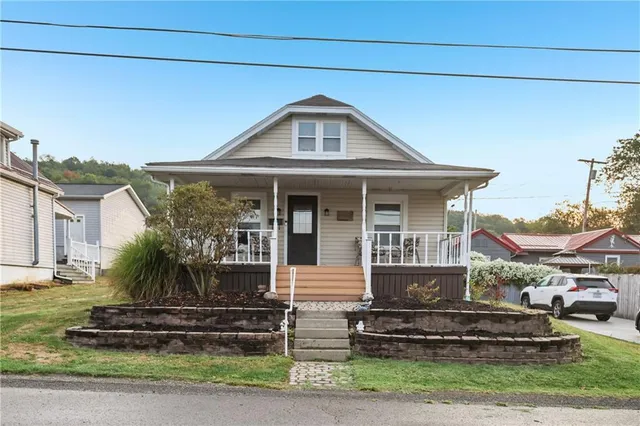 a front view of a house with a yard