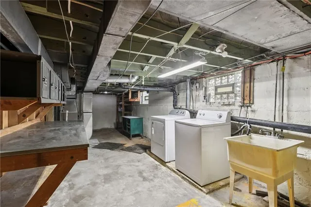 a kitchen with a sink and wooden cabinets