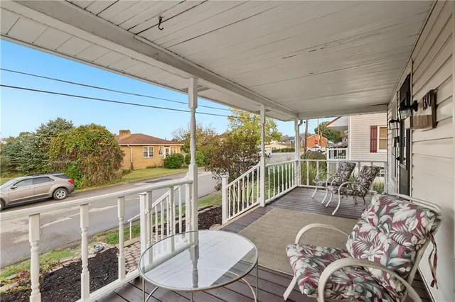 a view of a porch with furniture