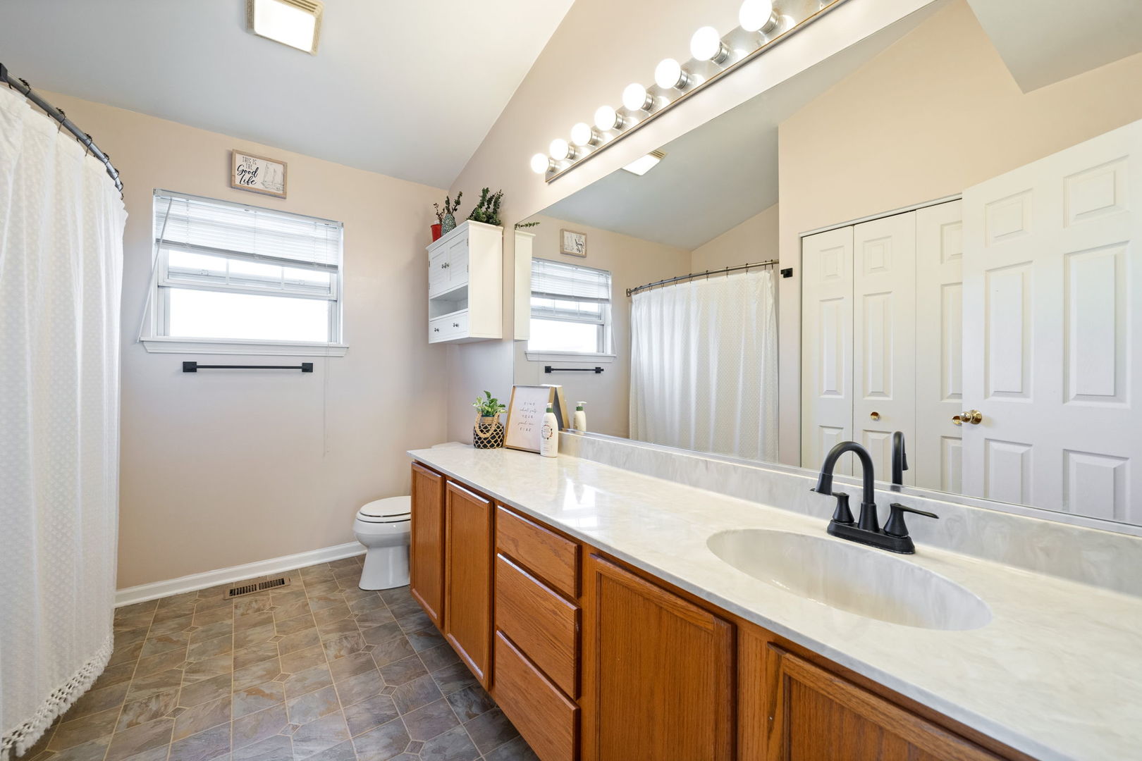 3409 Mustang Road Joliet, IL 60435 - Photo 13 of 28 a bathroom with a sink and a mirror