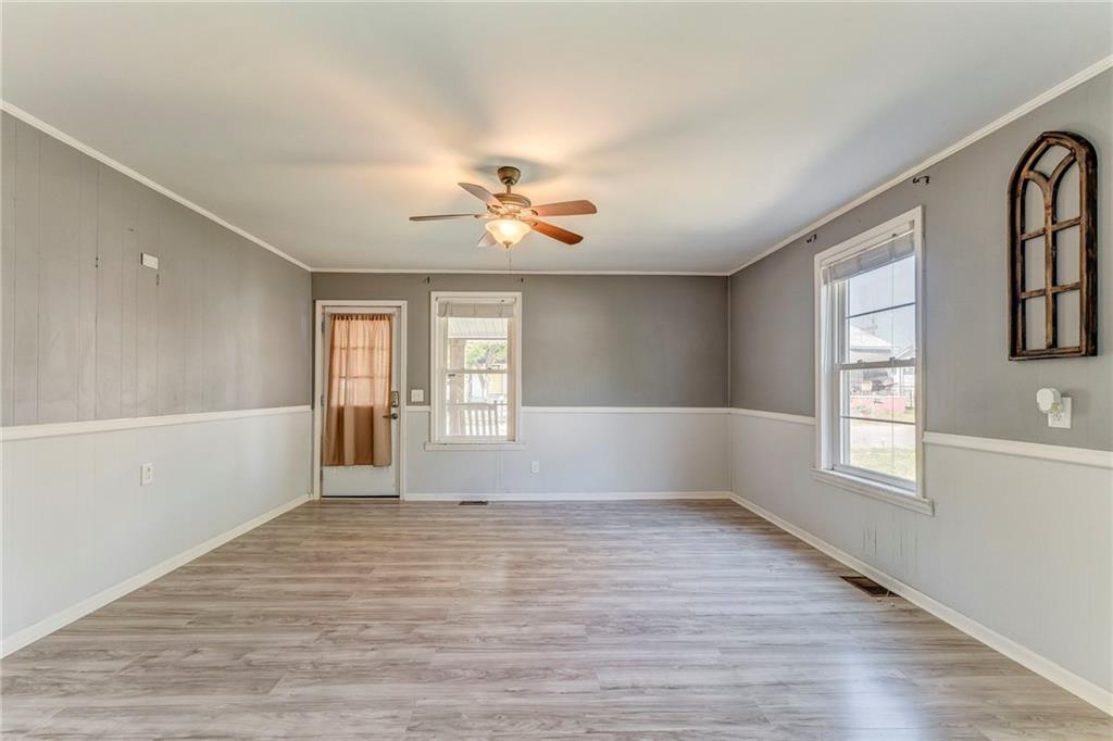 33 Elm Street Aragon, GA 30104 - Photo 14 of 34 a view of an empty room with a window and wooden floor