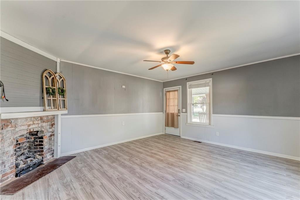 33 Elm Street Aragon, GA 30104 - Photo 15 of 34 a view of an empty room with window and wooden floor
