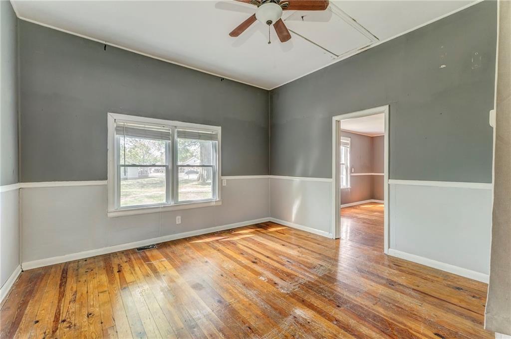33 Elm Street Aragon, GA 30104 - Photo 17 of 34 a view of an empty room with wooden floor and a window
