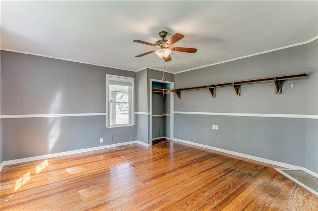 33 Elm Street Aragon, GA 30104 - Photo 19 of 34 a view of empty room with wooden floor and fan