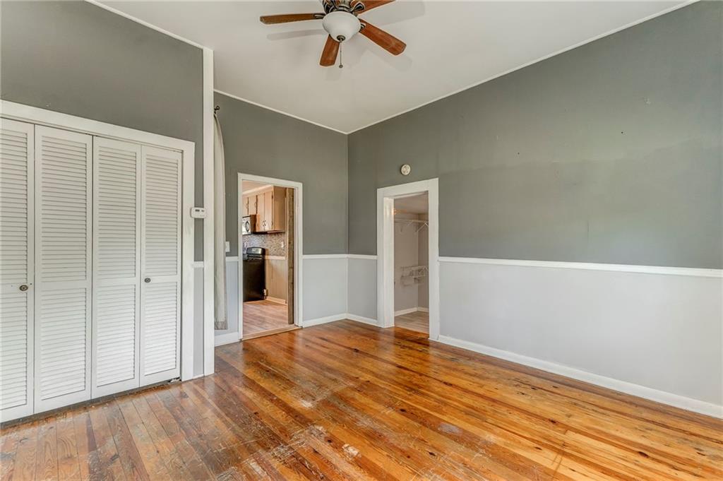 33 Elm Street Aragon, GA 30104 - Photo 20 of 34 a view of a livingroom with wooden floor and a ceiling fan