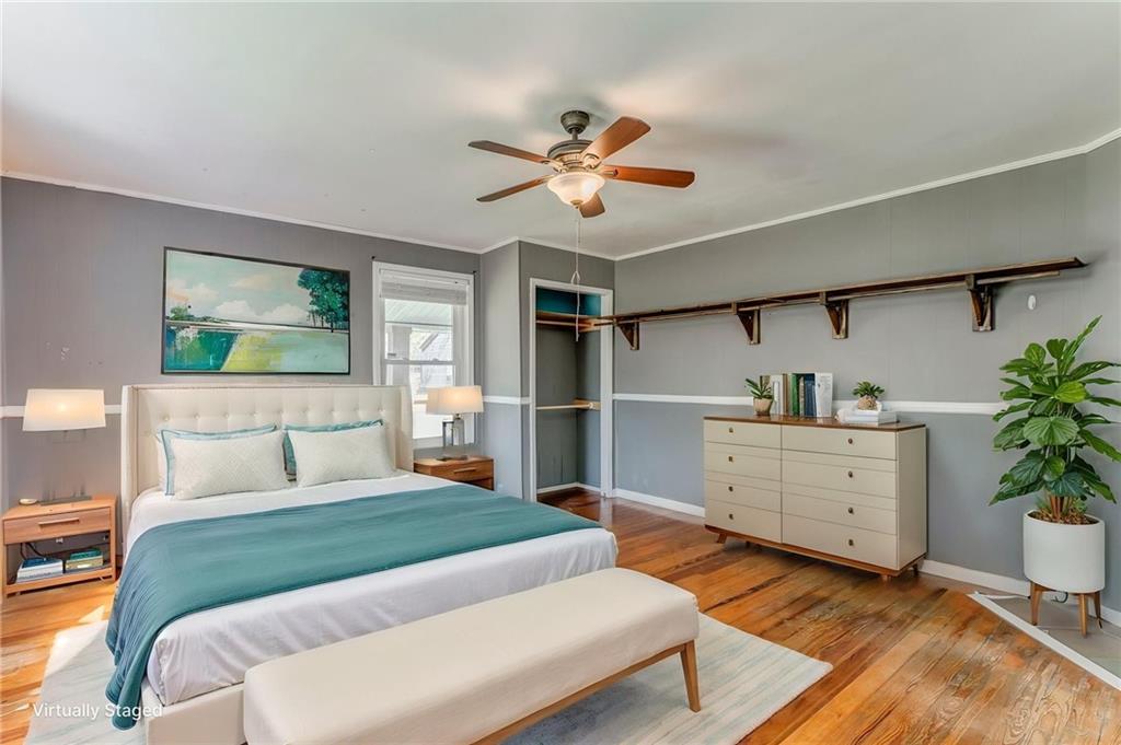 33 Elm Street Aragon, GA 30104 - Photo 24 of 34 a bedroom with a bed and a potted plant