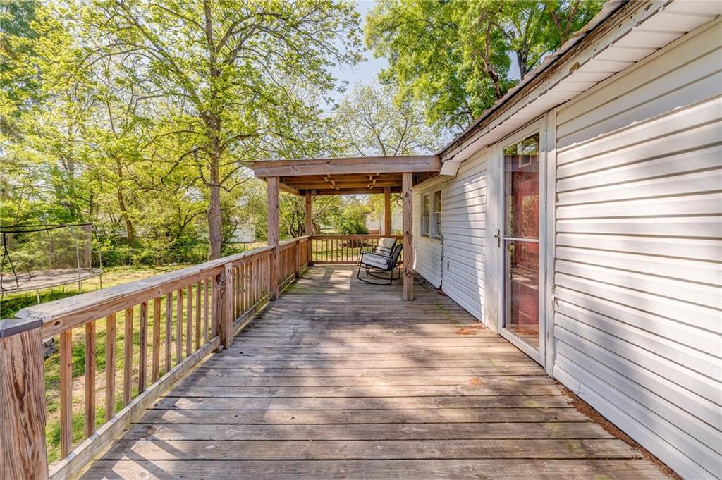 33 Elm Street Aragon, GA 30104 - Photo 26 of 34 a view of a patio with wooden floor and roof with a garden
