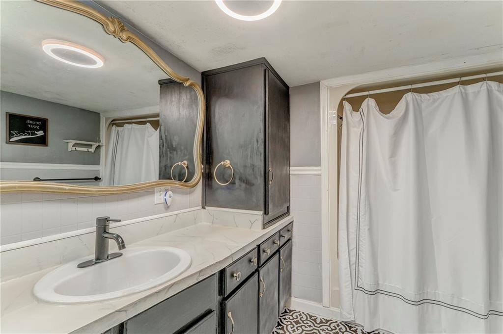 33 Elm Street Aragon, GA 30104 - Photo 29 of 34 a bathroom with a sink and a mirror