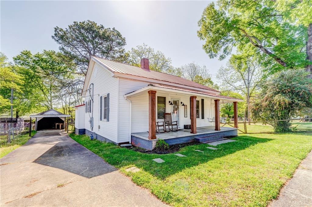 33 Elm Street Aragon, GA 30104 - Photo 3 of 34 a view of a house with a yard porch and sitting area