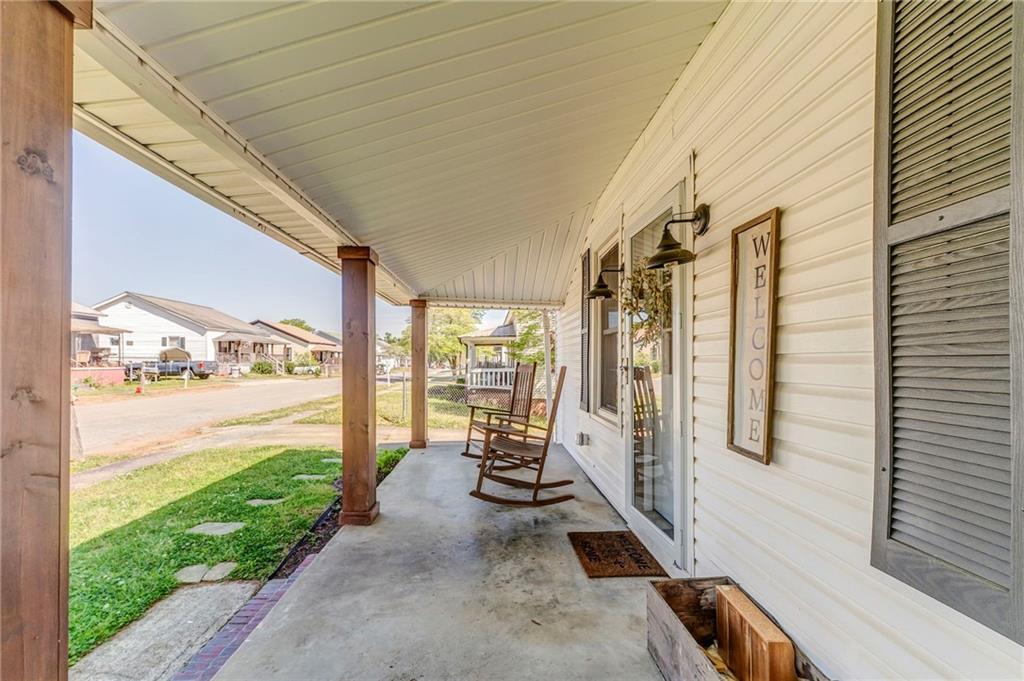 33 Elm Street Aragon, GA 30104 - Photo 5 of 34 a view of a porch with furniture and floor to ceiling window