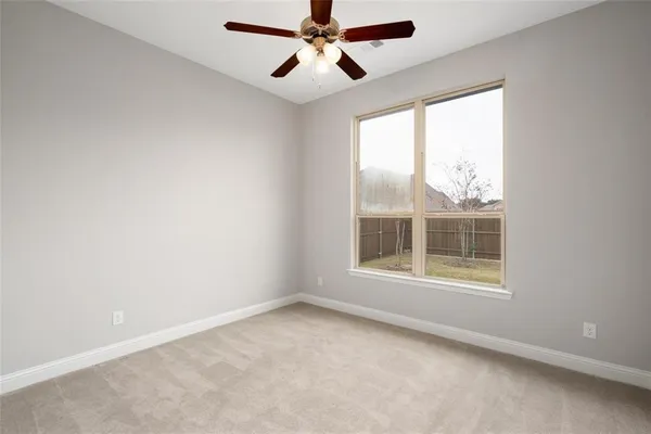 a view of room with stairs and wooden floor