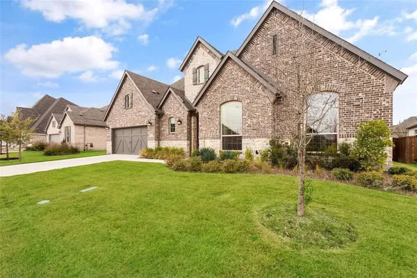 a front view of a house with yard