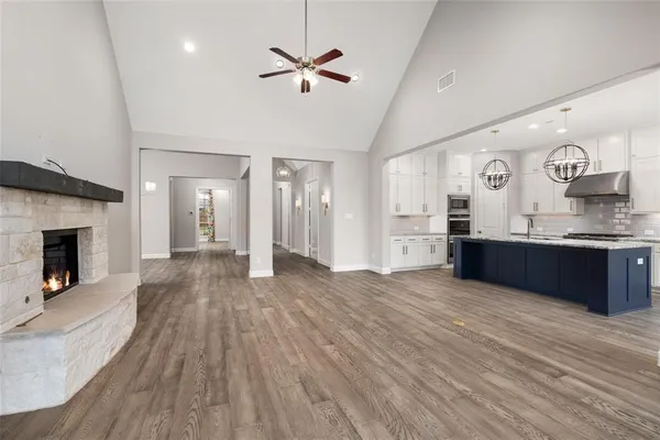 a kitchen with a sink and chandelier