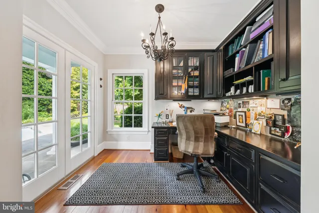 a dining room with fireplace furniture and a chandelier