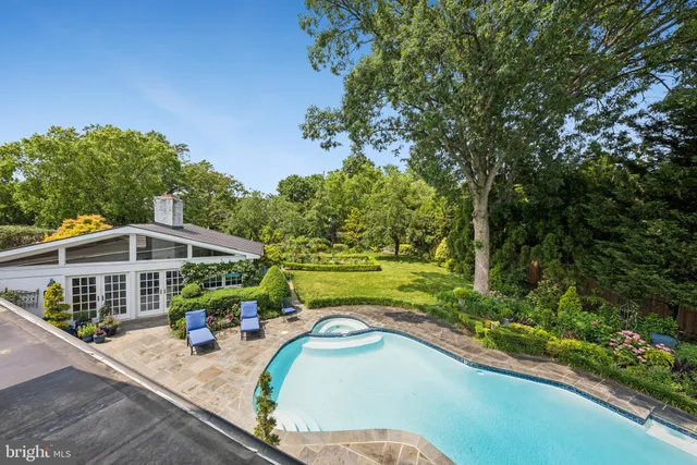 a spacious bedroom with a bed and a window