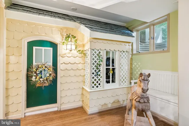 a front view of a house with porch and garden