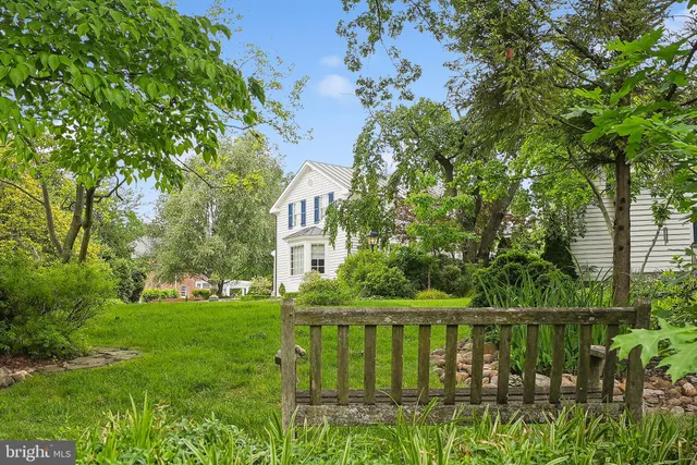 a view of a lake with a house in the background