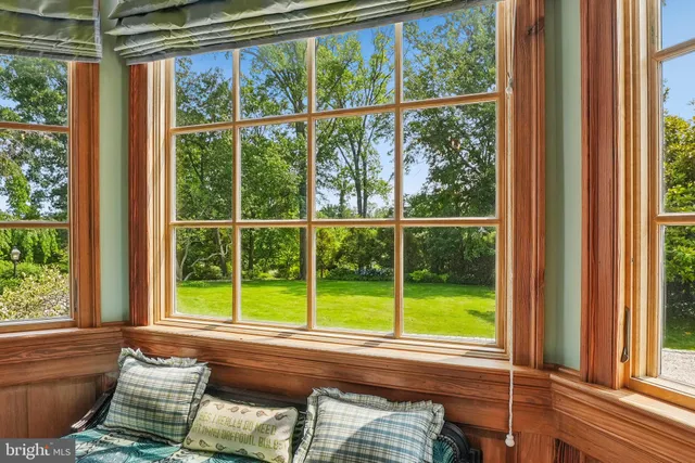 a view of a room that has a bed and a window