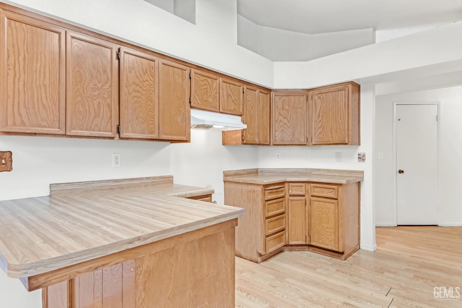 Undisclosed Address Bakersfield, CA 93313 - Photo 13 of 33 a kitchen with stainless steel appliances granite countertop a sink stove and cabinets