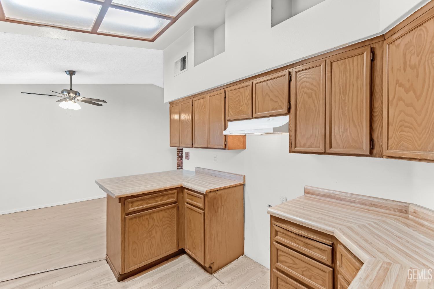 Undisclosed Address Bakersfield, CA 93313 - Photo 15 of 33 a kitchen with a sink cabinets and appliances