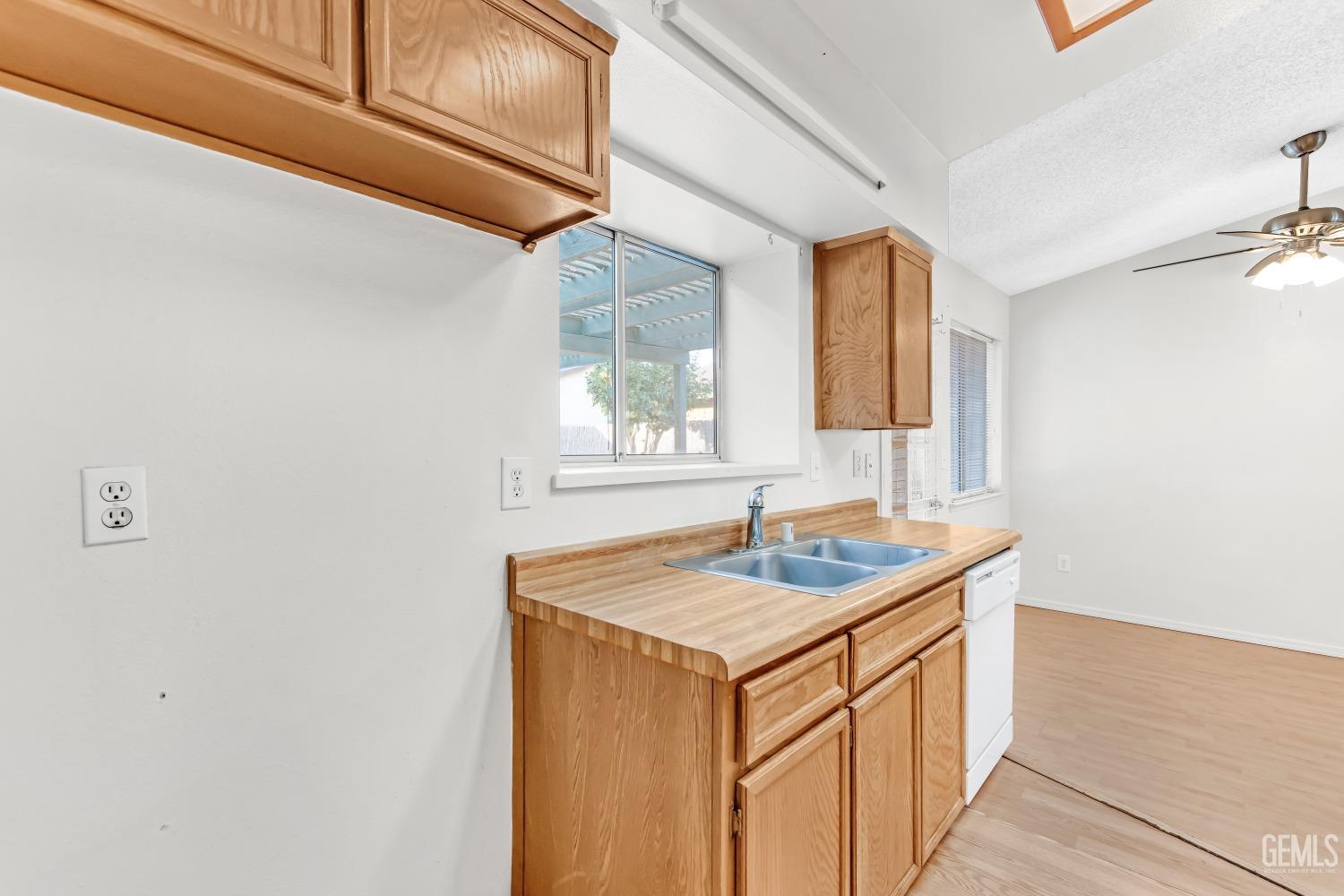 Undisclosed Address Bakersfield, CA 93313 - Photo 16 of 33 a bathroom with a sink a vanity and a window