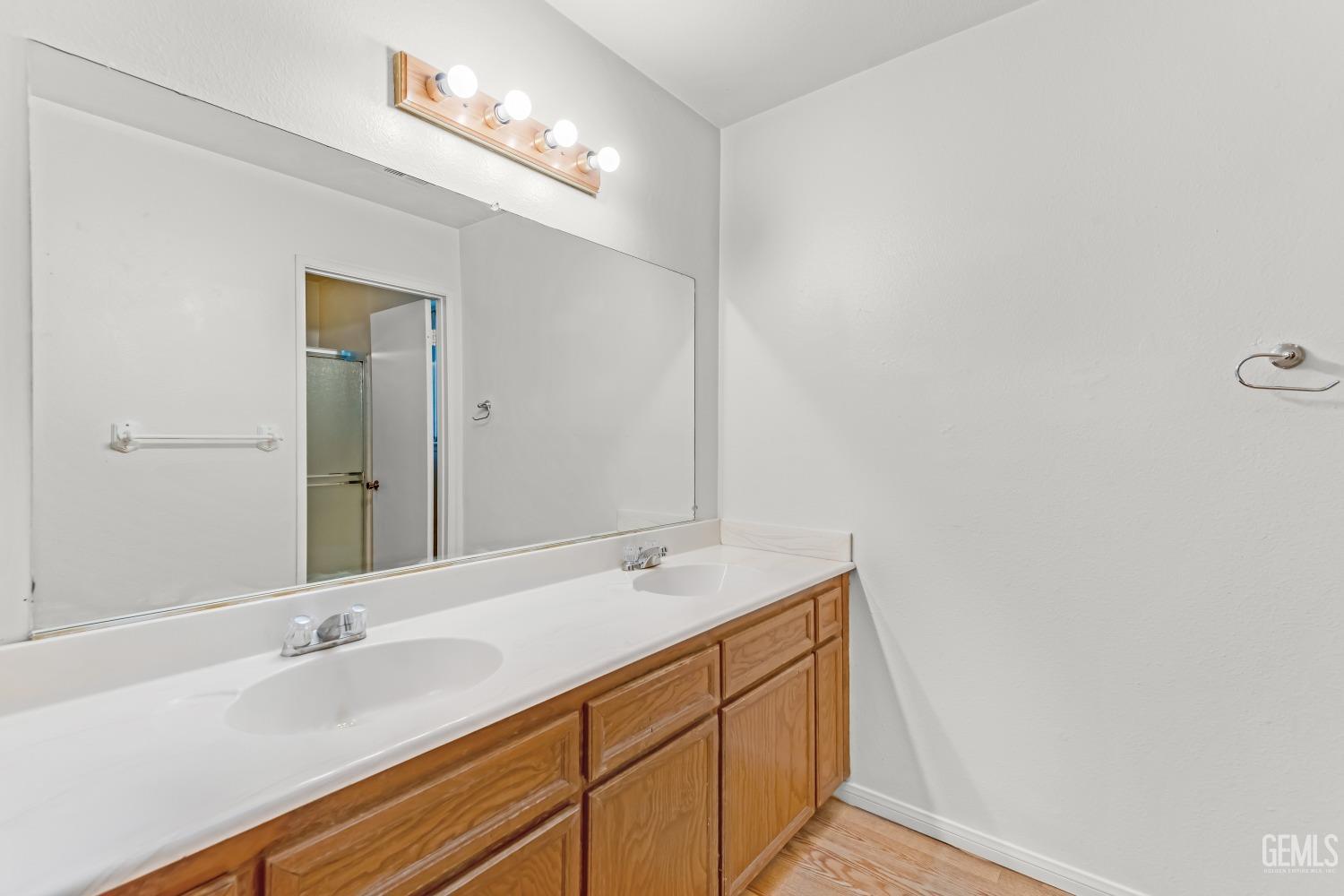 Undisclosed Address Bakersfield, CA 93313 - Photo 24 of 33 a bathroom with a sink and a mirror