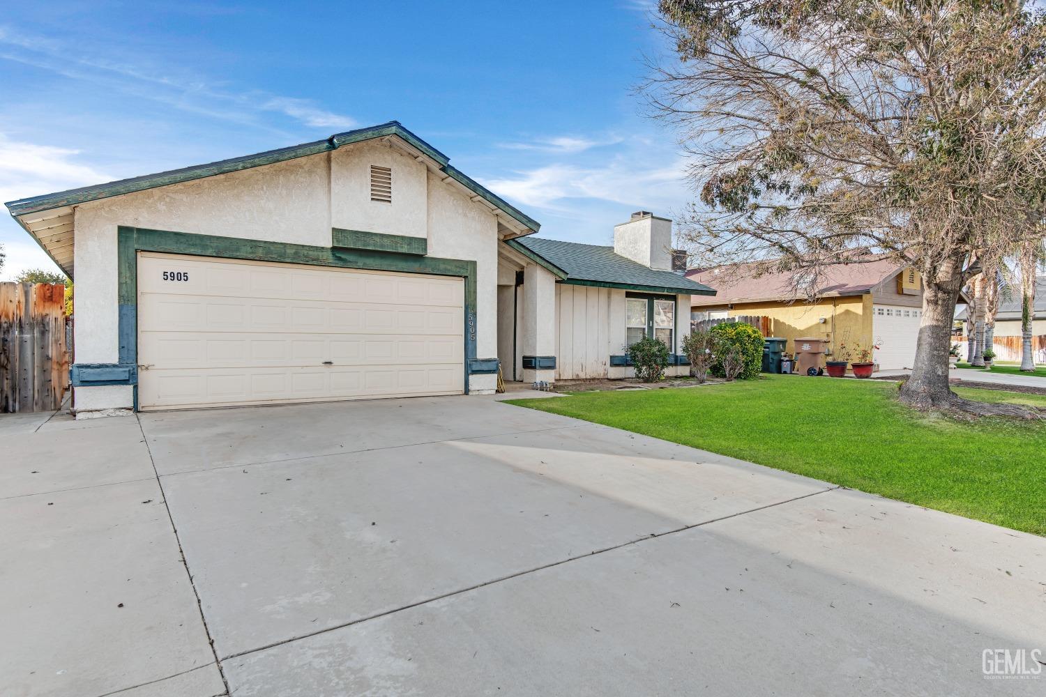 Undisclosed Address Bakersfield, CA 93313 - Photo 3 of 33 a front view of house with yard