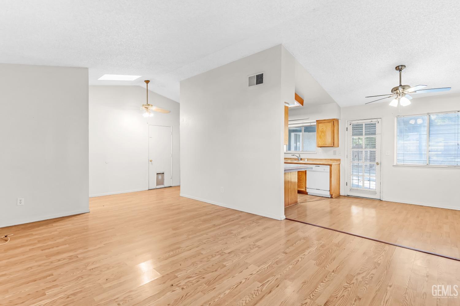 Undisclosed Address Bakersfield, CA 93313 - Photo 8 of 33 a view of a kitchen with wooden floor and a kitchen space