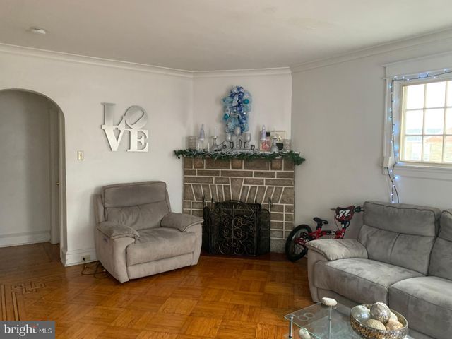 a table room with a table chairs and a window
