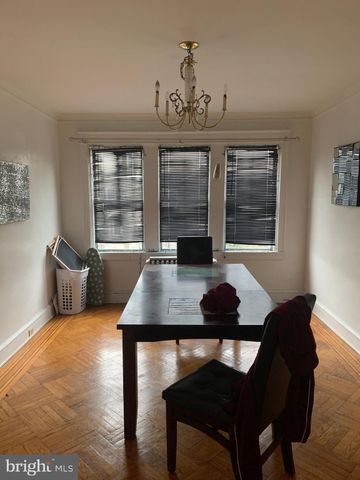 a kitchen with a stove a sink and a cabinets