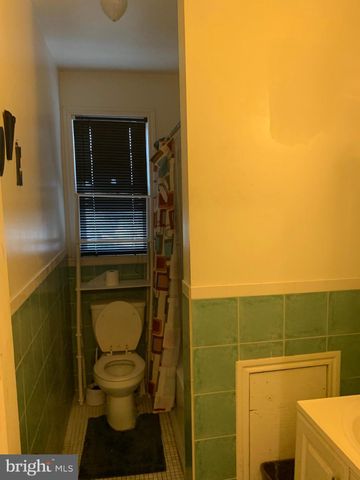 a living room with furniture a table and a window