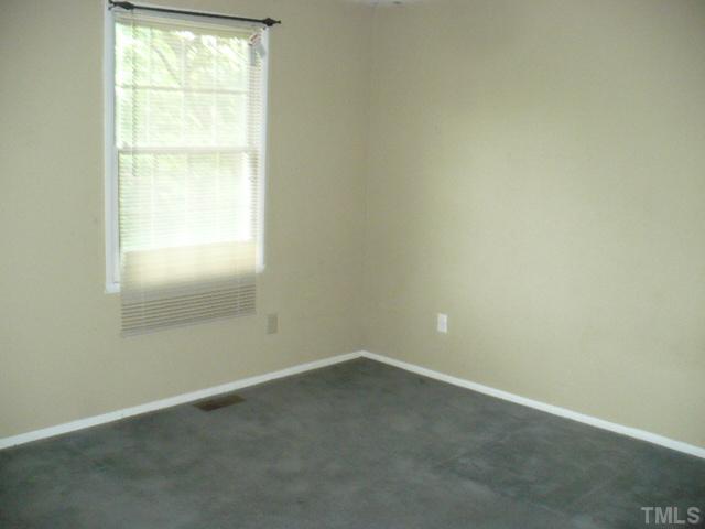 7723 Ohmann Court Raleigh, NC 27615 - Photo 13 of 16 an empty room with a window