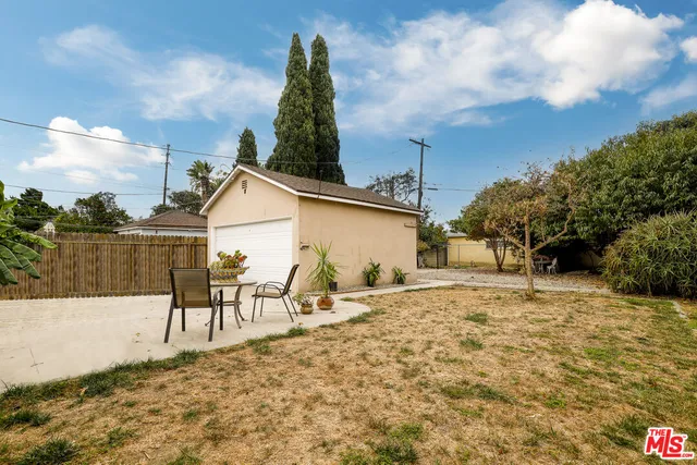 a wooden bench sitting next to a road