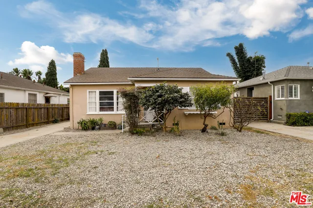 a house view with a sitting space and garden space